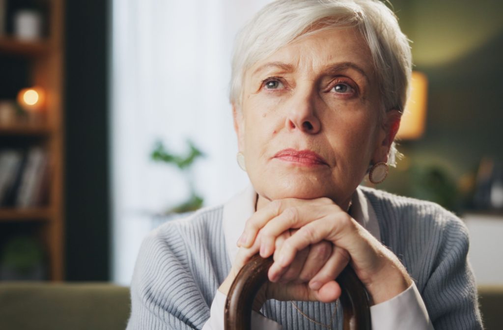 an older woman contemplating what age dementia can set in.